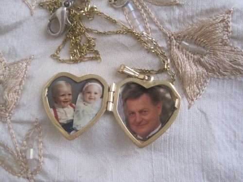 My precious locket with my husband and my babies